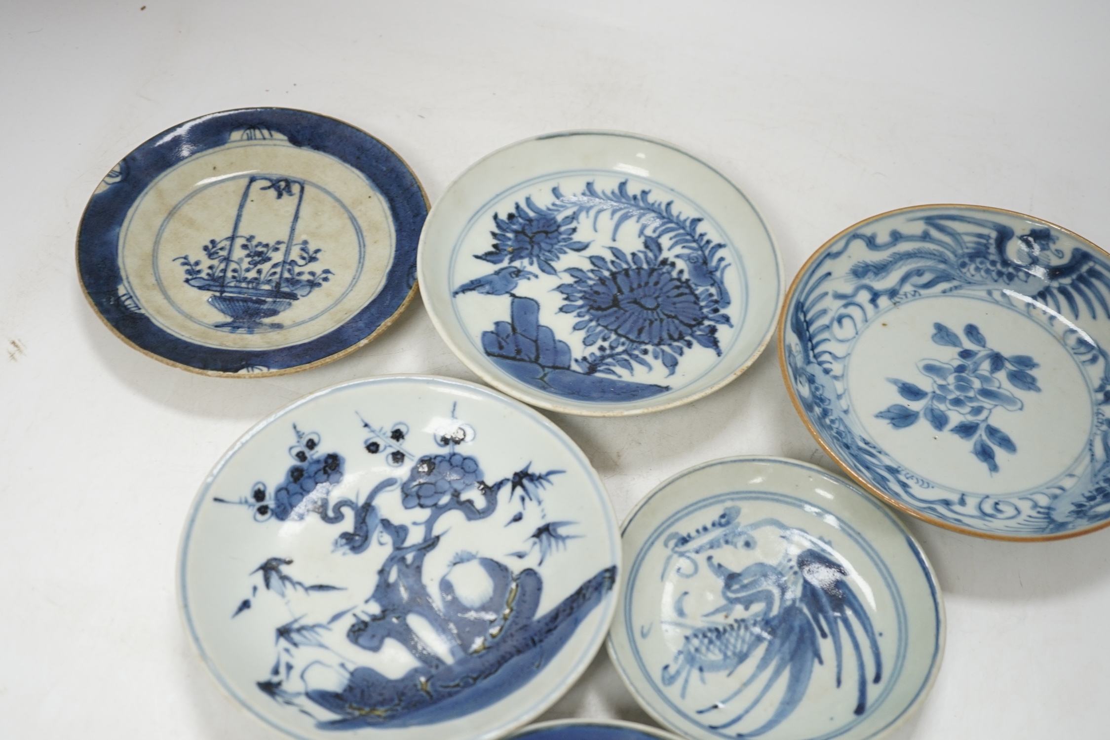 A group of 18th/19th century Chinese blue and white saucers and shallow dishes, largest 18cm in diameter. Condition - varies, mostly fair